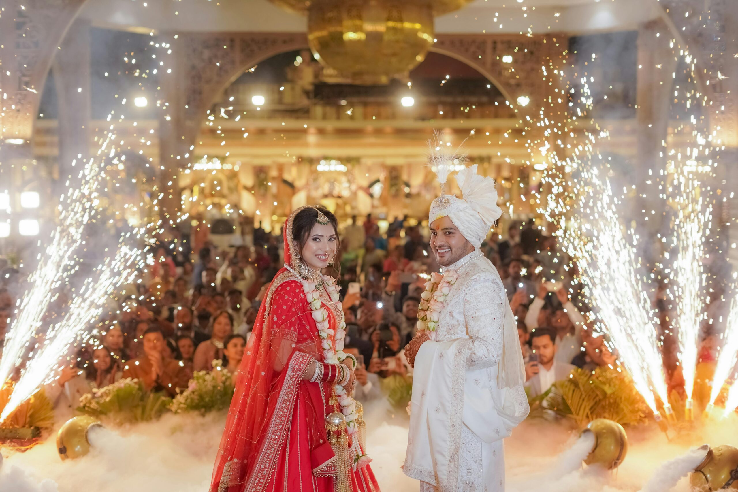 Joyful Indian wedding in Delhi with vibrant attire and dazzling fireworks.